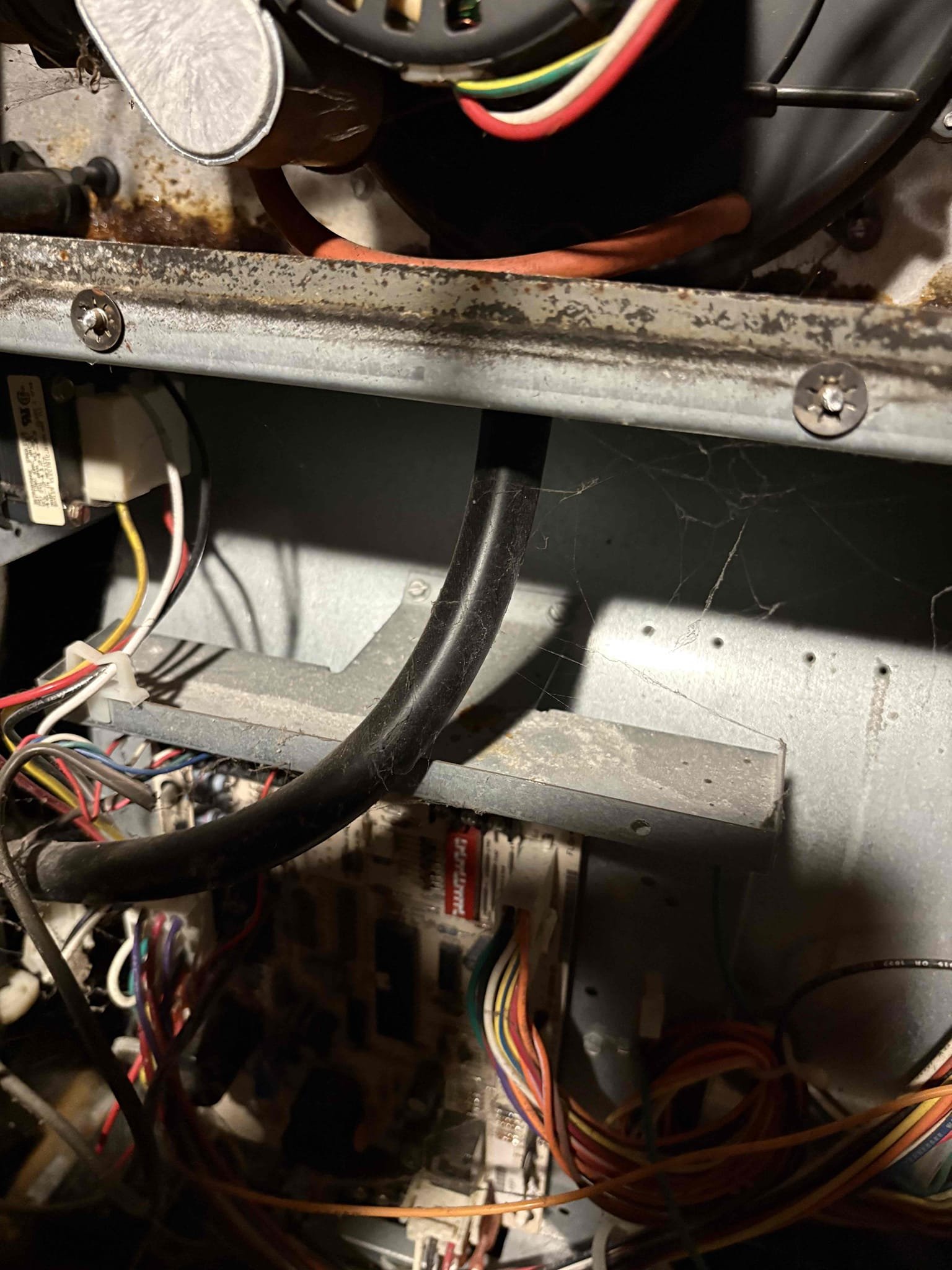 Upon inspection, the unit was not heating. I removed the door to investigate further and discovered a significant accumulation of water and rust, likely originating from the secondary heat exchanger. After thorough examination, it was determined that the root cause was a faulty gas valve. Given the extensive water and rust damage, which compromises the unit's integrity, I advised the customer that the best course of action would be to replace the unit. The customer agreed and signed the estimate for a Goodman replacement unit, scheduled for installation tomorrow.