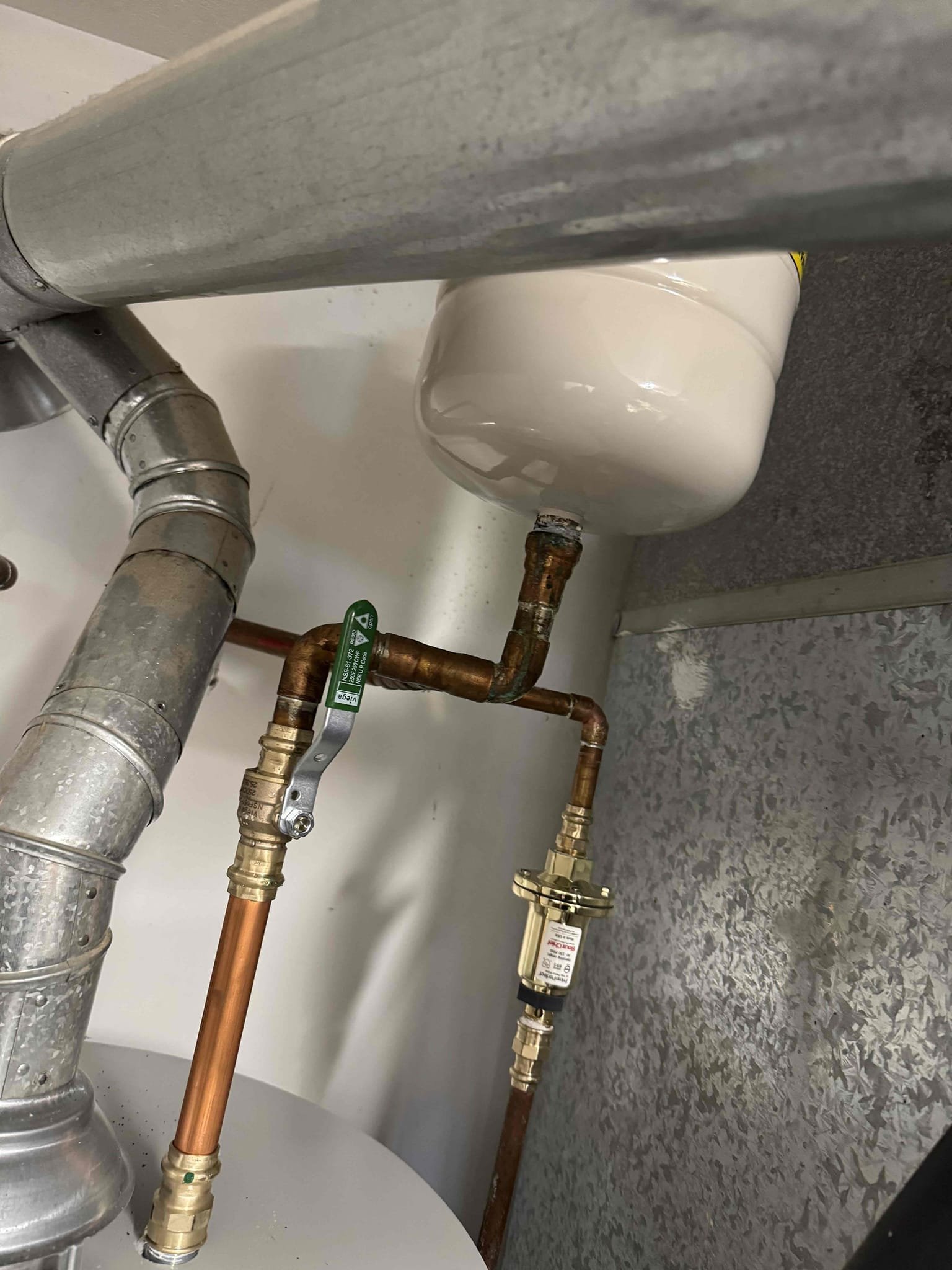 This project involved removing the existing 40-gallon gas water heater, disconnecting it, and safely disposing of it. A new 40-gallon gas water heater was installed in a drain pan for added protection. The leaking trap primer was replaced, and the corroded ½-inch copper pipe was also replaced. All labor and standard materials were included. Any additional issues or code upgrades were handled through a change order.