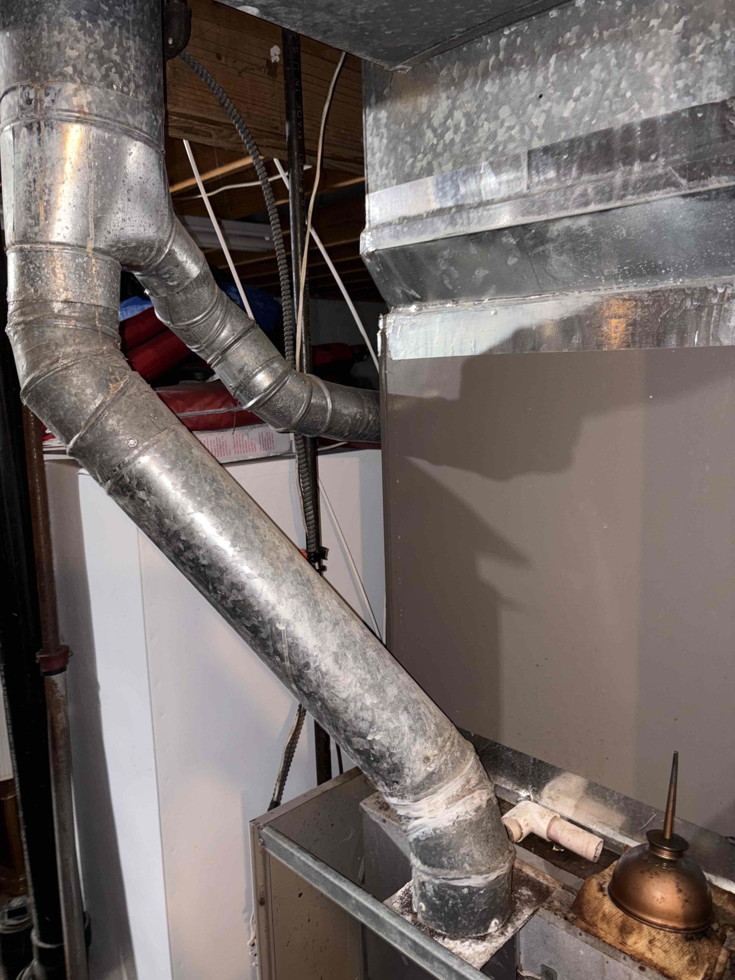 Upon inspection, the unit was not operational. I checked the system and discovered a lack of 24 volts reaching the W wire. By temporarily bypassing the unit, I identified multiple issues during the heating cycle. The furnace module repeatedly clicked the igniter, and the gas valve opened and closed continuously. Removing power from the W wire caused the inducer motor to run indefinitely until I tapped the relay. I found a 5-amp fuse wrapped in aluminum tape, which was completely melted. Burn marks on the connections confirmed a short circuit. I recommended a replacement due to likely compromised parts and the unit's age. I emailed the customer replacement estimates and turned off the power at the breaker.