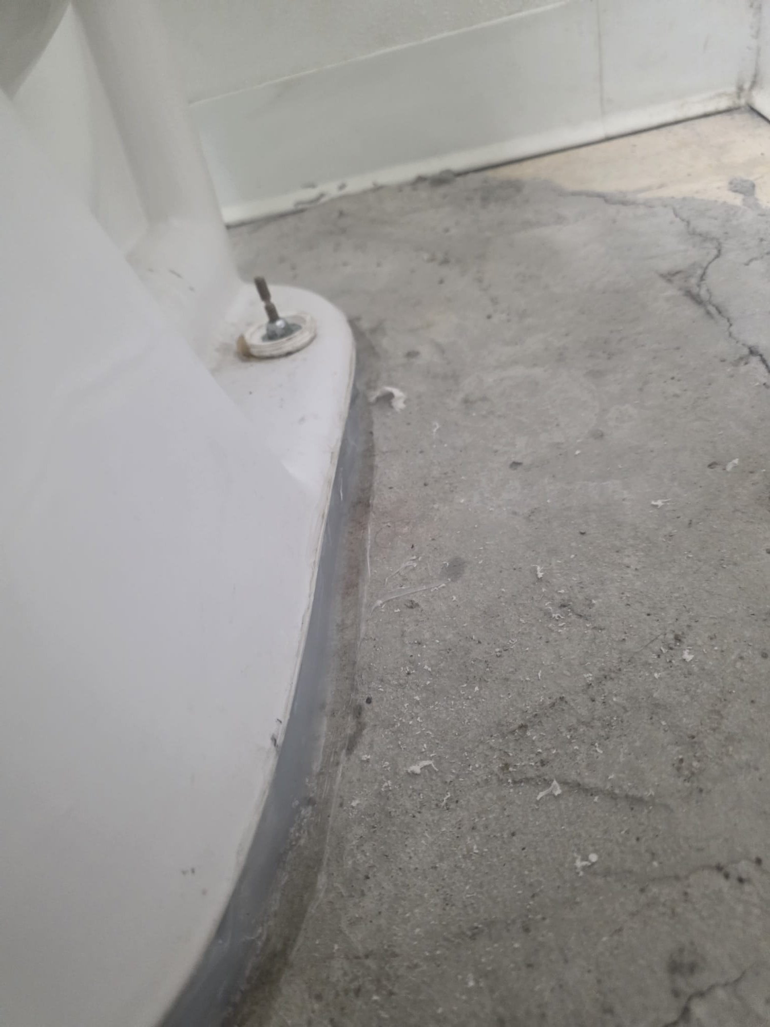 The job involved removing a broken plastic flange and installing a new stainless steel flange, securely bolted to the concrete for durability. Upon removal, I discovered an insert-style flange, necessitating a switch to a PVC flange. The floor's unevenness required shimming the toilet for stability, and I applied silicone to seal the base. After installation, I tested the toilet for proper operation and leaks, ensuring all components functioned correctly. The work was completed to guarantee solid support and optimal performance of the toilet.