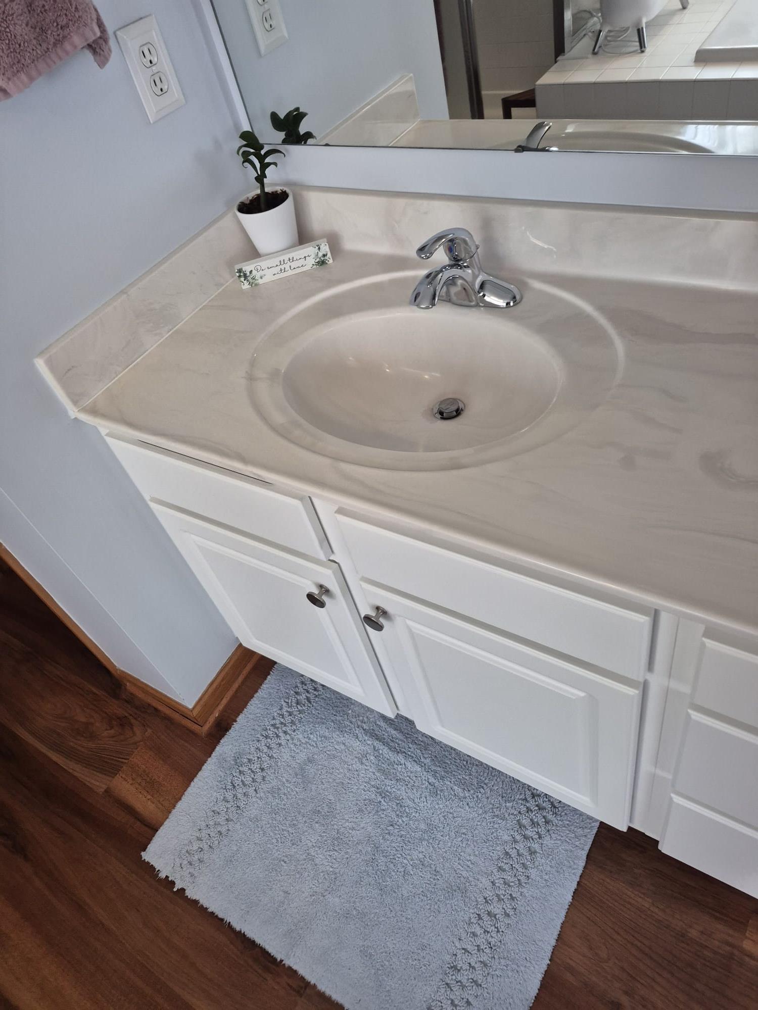 Hilliard, OH - During the plumbing maintenance, I flushed the Rheem tankless water heater, which performed excellently without any issues. I inspected all 2.5 bathrooms, ensuring the Mansfield toilets flushed properly and did not wobble. The vanity sinks had good flow, with no leaks and well-maintained P-traps. The showers and tubs were also checked, with tub spouts functioning well and drains operating smoothly. All valves were Delta, and the radon system was already installed, reading at 0.6.