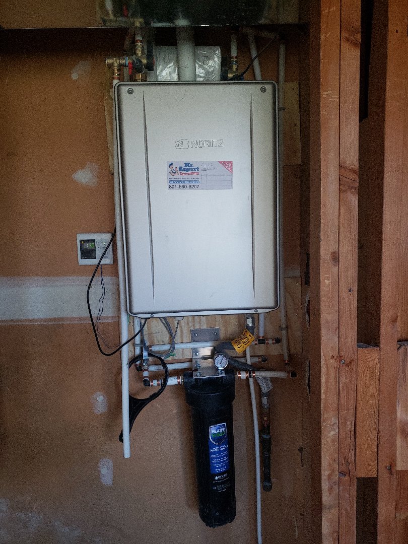 Tankless water heater installations and heater shield  in Cottonwood area.