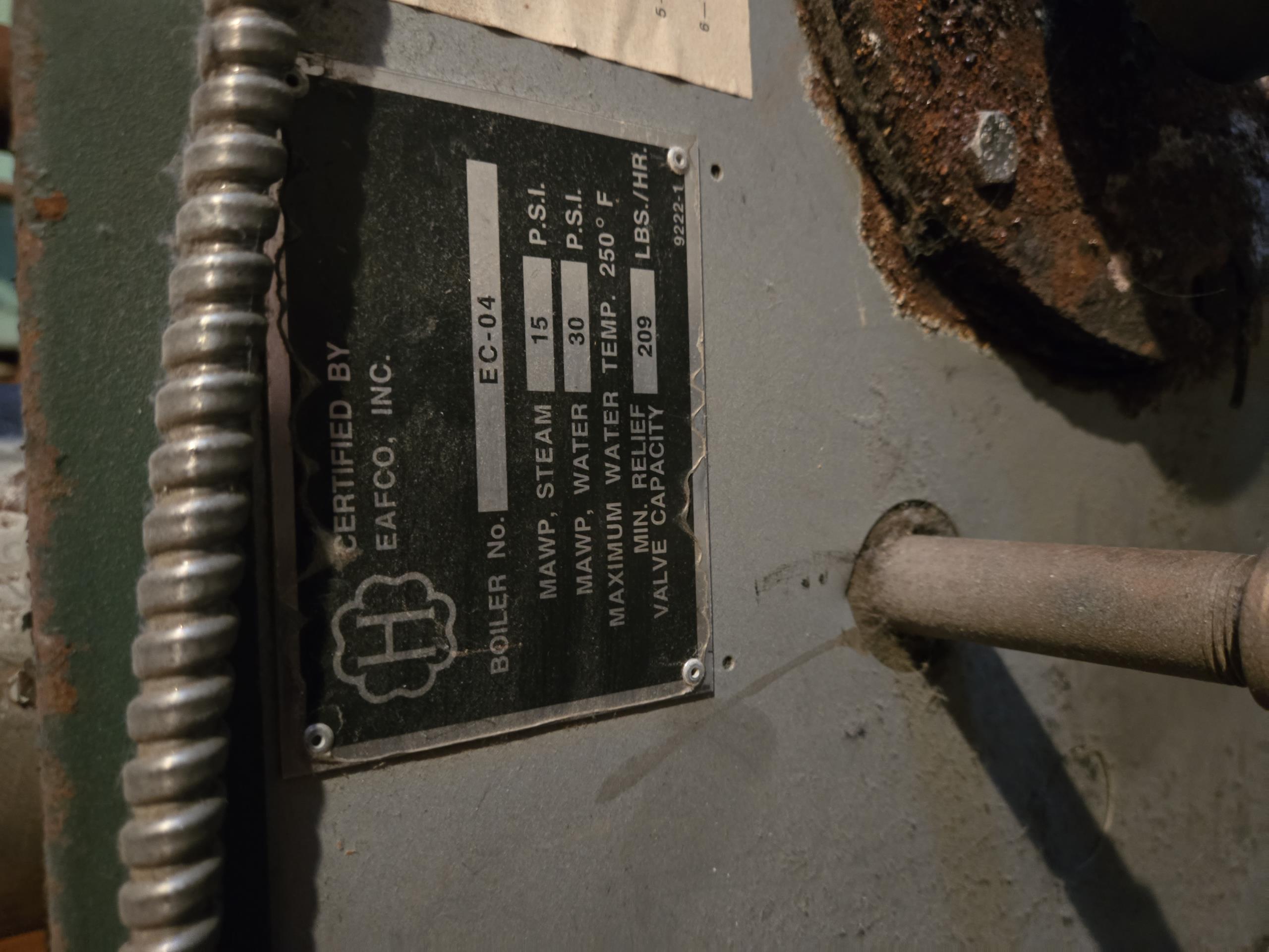 Replacement of the existing Peerless EC-04 oil-fired steam boiler with a new, standard efficiency cast iron steam boiler. The new boiler will be precisely sized based on the calculated 455 sq ft of Equivalent Direct Radiation (EDR) for the home's heating load, ensuring optimal performance and efficiency for your one-pipe steam system.

All existing boiler components, including the immediate surrounding piping, will be replaced to ensure the new system's reliability. The existing cast iron radiators and their thermostatic valves will remain untouched.

The new boiler will utilize the existing chimney for venting, provided that a chimney inspection confirms it is suitable for safe and efficient operation. The existing fresh air intake will be modified to properly serve the new burner.

The existing oil tank will remain in place. A new 40-foot length of coated oil line will be installed from the oil tank to the new boiler, along with a new oil filter.

Due to the absence of a bulkhead, th