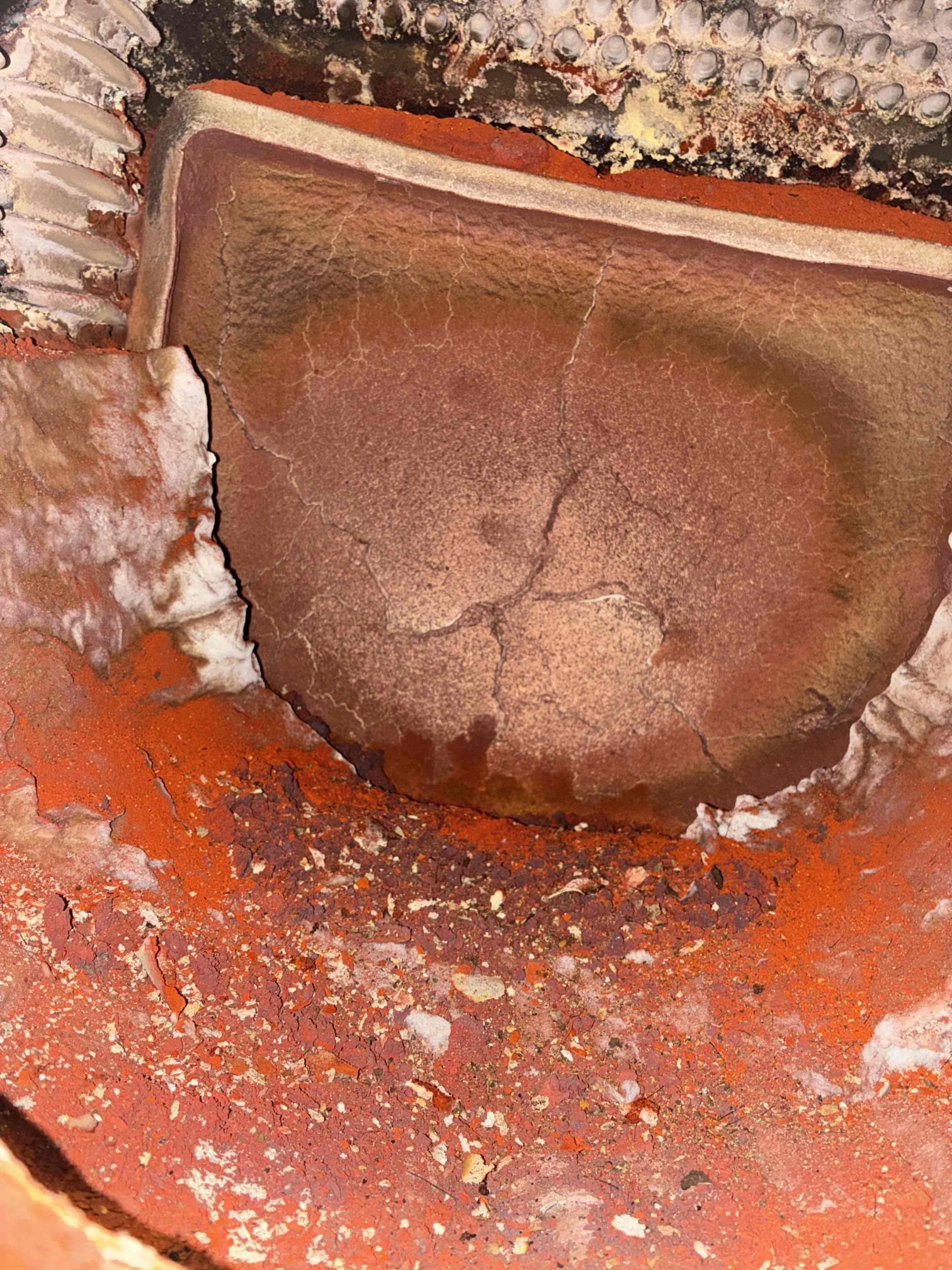 Completed the oil boiler maintenance today. I replaced the oil filter, the pump strainer and the nozzle. I pulled the clean out off of the boiler and I brushed and vacuumed out the heat exchanger. I tested the pump pressure and that was within manufacture specifications. I ran the unit and performed a smoke test and got zero smoke. I also performed a combustion analyzer test that checks the CO, CO2 and oxygen levels and the boiler was running great. I noticed that the target wall and the floor in the boiler are starting to fall apart. I’m adding a photo with the estimate and emailing it to the client. 