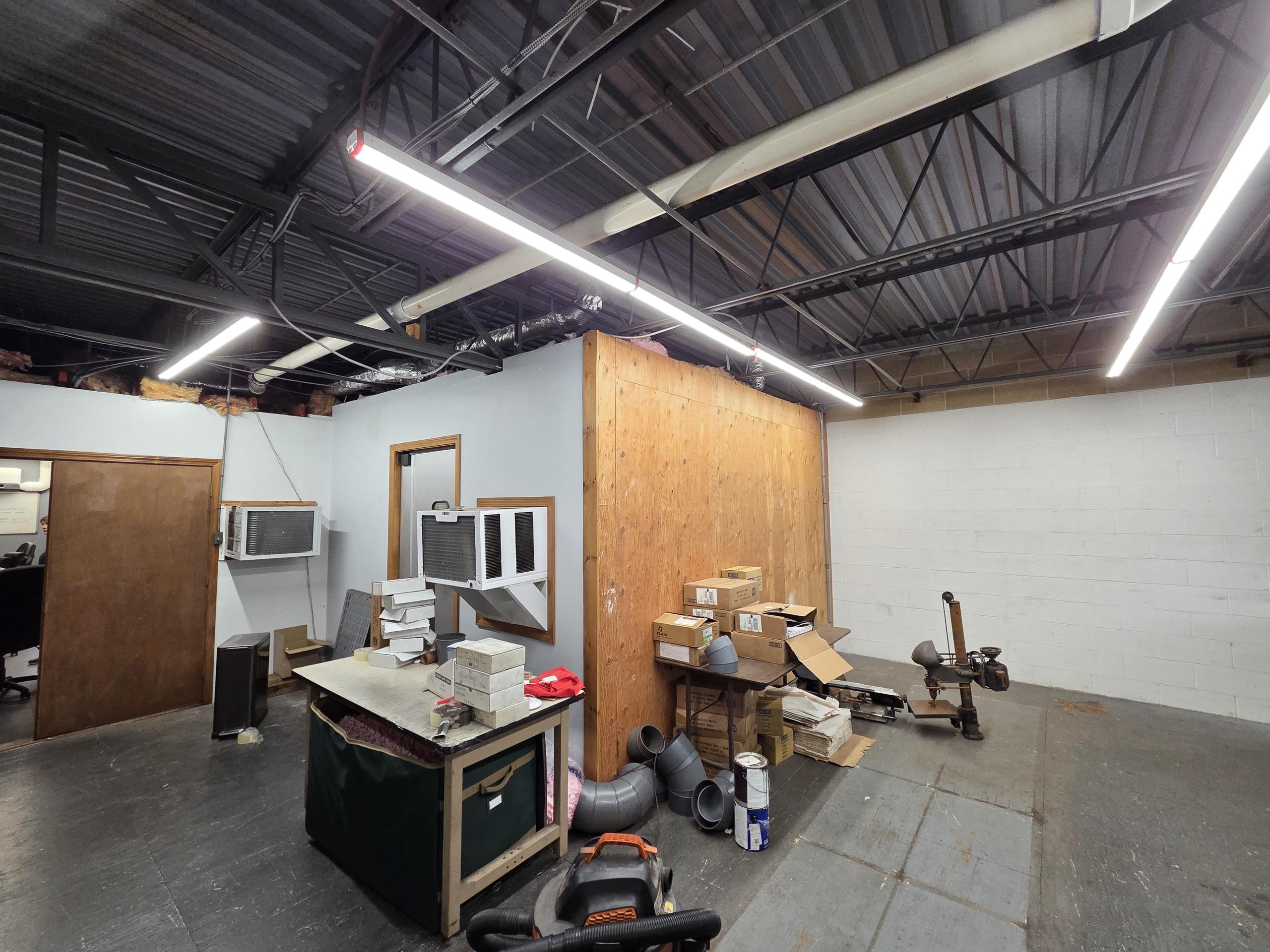 Installation of an additional mini-split head for the new conference room area, including modification of existing head connections and installation of one additional supply and return feed for the existing ERV (Energy Recovery Ventilator) system.

A new 12,000 BTU indoor unit will be installed in the New 2nd Floor Conference Room and connected to System B. To balance the capacity between the two existing outdoor units, we will reassign certain office zones:

Mike/Greg's Office will be moved from System B to System A.
1st Floor Assembly will be moved from System A to System B.

The final system configuration will be:
System A
Mike/Greg’s office: 12k BTU
2nd Floor Assembly (Back): 9k BTU
2nd Floor Assembly (Front): 15k BTU

System B
1st Floor Lobby: 9k BTU
1st Floor Assembly: 9k BTU
New 2nd Floor Conference Room: 12k BTU

We will provide pitch pocket filler to re-seal the roof penetrations when installing the new lines. However, the client must verify if the roofing company wishes to re