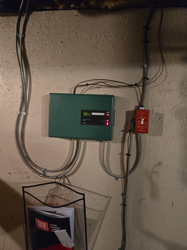 Scope of Work:
Replacement of the existing oil-fired boiler with a new, reliable Cast Iron Oil Boiler featuring an internal tankless coil for domestic hot water.

Hydronic Piping Upgrade (GSMS Standard):

Circulator Conversion: We will remove the existing system of zone valves and a single pump. The system will be repiped to feature dedicated circulator pumps for each of the two heating zones. This upgrade provides better flow, redundancy, and reliability.

Near-Boiler Piping: Installation includes our complete piping package: new isolation flanges, high-performance air eliminator, expansion tank, automatic feed valve, and backflow preventer.

Domestic Hot Water:

The new boiler will include an internal Tankless Coil to generate domestic hot water, maintaining the same style of operation as the current system.

Venting & burner:

A new high-efficiency oil burner will be set up and calibrated.

The boiler will be connected to the existing chimney flue.