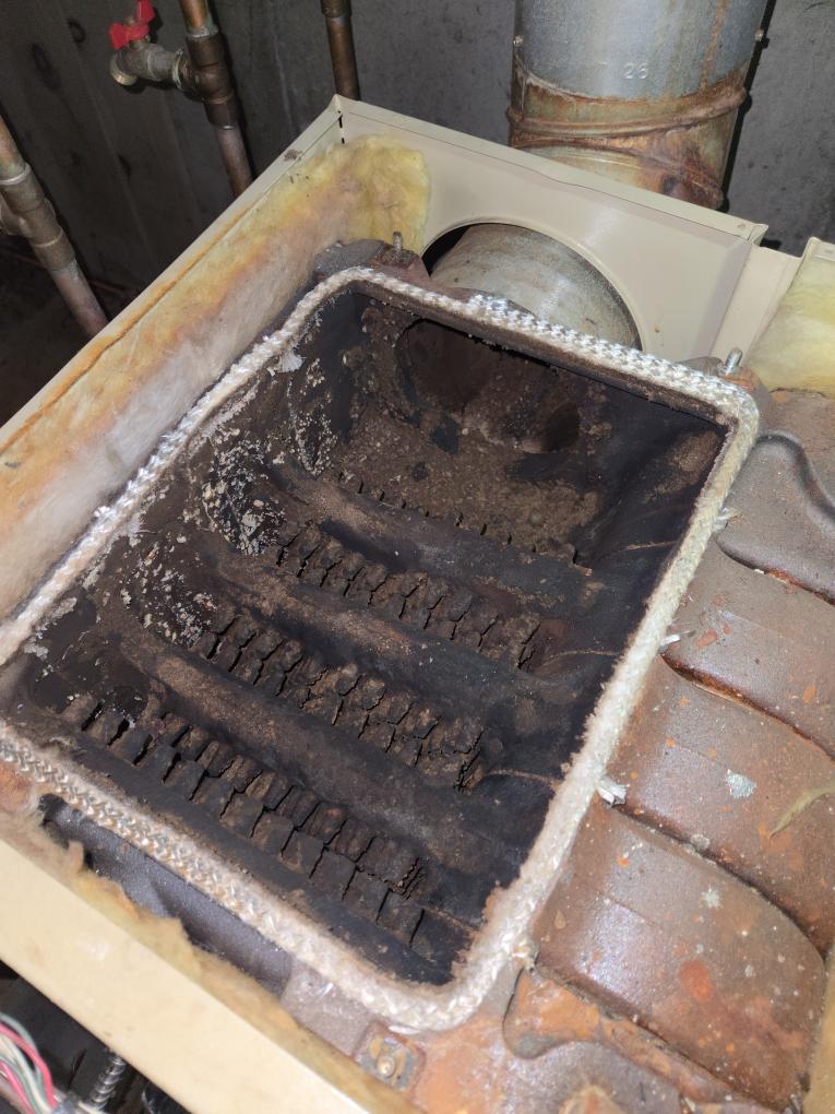 Completed the oil boiler maintenance today. I started off with replacing the oil filter, the pump strainer and gasket and the nozzle. I checked all the boiler accessories and everything looked good other than the auto fill valve is leaking from the threaded connection. I brushed and vacuumed out the heat exchanger. I noticed that the boilers PSI was set pretty high so I drained it down and set the boiler PSI to 13. Lastly I ran the boiler and performed a smoke test and got zero smoke. I performed a combustion analyzer test, this checks the units CO, CO2 and oxygen levels. The boiler was running great. As the boiler started to heat up I noticed that there was water leaking under it. The client wanted to leave it for now and keep an eye on it. The indirect water tank has been leaking for a little bit. We will send over an estimate to replace it. I let the client know that we need to do a water test since she has no water treatment. She said that she was going to do the water test and sen