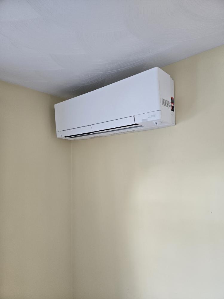 This proposal outlines the installation of a premium 5-Zone Mitsubishi heat pump system. To honor your request of having only one outdoor unit while properly serving all three levels of the home (basement, first floor, and second floor), we have upgraded the design to utilize Mitsubishi’s advanced Smart Multi system. This commercial-grade technology uses a centralized "Branch Box" distribution method, allowing us to run the extended refrigerant line lengths required for this specific floor plan while strictly adhering to manufacturer engineering specifications.

Scope of Work

1. Outdoor Equipment & Distribution

Condenser Placement: Supply and install one (1) Mitsubishi Smart Multi outdoor heat pump condenser. The unit will be located on the gable end of the home (garage side), neatly tucked into the corner where the chimney jogs out.

Attic Branch Box: Install the required Mitsubishi Branch Box up in the attic space. The main refrigerant trunk line will route from the outdoor unit up