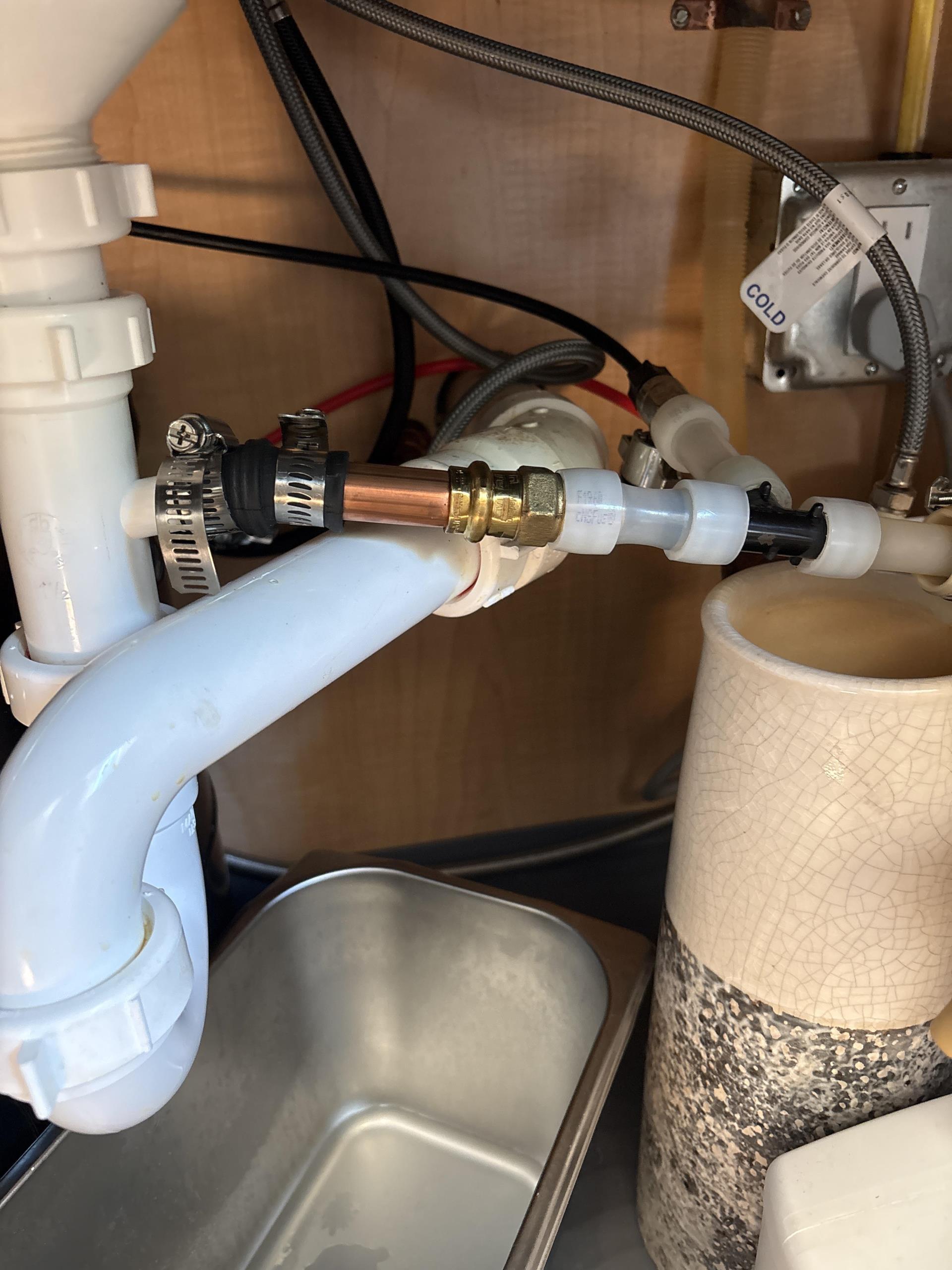 Installed hanger on dishwasher line