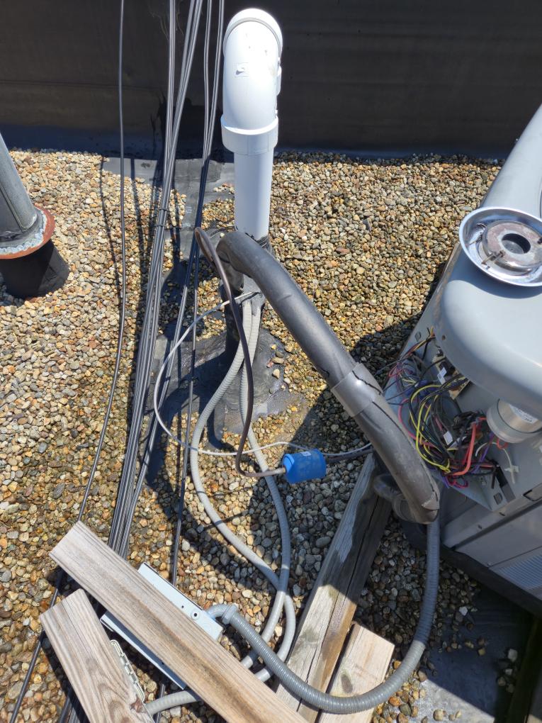 Completed the AC maintenance today. I replaced the filter. I rewraped the suction line with insulation. Everything was running great. There is a tear in the roofing sealant where the line set goes into the building, please see the attached picture.