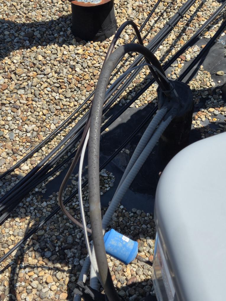 Completed the AC maintenance today. I replaced the filter. I rewraped the suction line with insulation. Everything was running great. There is a tear in the roofing sealant where the line set goes into the building, please see the attached picture.