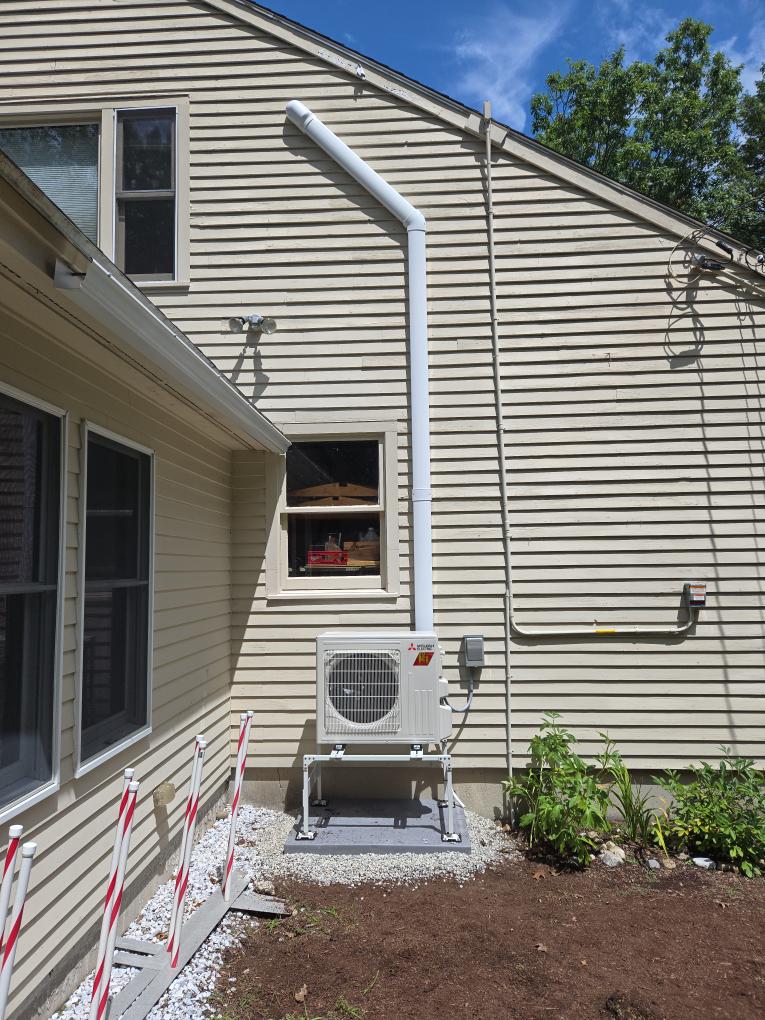This option is designed to bring dedicated, high-efficiency comfort specifically to the second-floor Main Bedroom. We are proposing a Mitsubishi Single-Zone heat pump system. While this system is optimally sized to provide powerful, whisper-quiet air conditioning during the humid summer months, it will also act as highly efficient supplemental heating during the chilly spring and fall shoulder seasons.

Scope of Work

1. Indoor Equipment & Placement

Equipment: We will install a brand-new Mitsubishi wall-mounted ductless head in the 2nd-floor Main Bedroom.

Compact GX Series: Because the available wall space is tight, we have specifically designed this system using Mitsubishi's compact GX Series indoor unit. This ensures it will fit perfectly on the wall while still delivering exceptional performance.

Placement Details: The unit will be mounted to the left of the large window.

Controls: This unit will be controlled via an intuitive handheld remote.

2. Outdoor Equipment & Line Set Ro