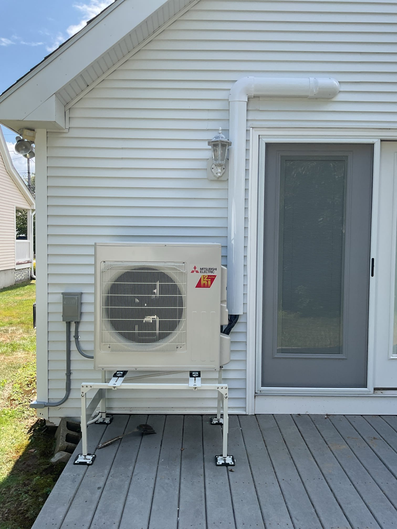 This project is designed to bring top-tier, year-round comfort to the back great room of your summer home. We will be installing a high-efficiency Mitsubishi Hyper Heat single-zone system. This system will provide powerful, whisper-quiet air conditioning during the humid summer months, and reliable, highly efficient heating during the chilly coastal shoulder seasons and winter months.

Scope of Work

1. Indoor Equipment & Placement

Equipment: We will safely mount a brand-new Mitsubishi ductless wall unit in the back great room.

Placement Details: The unit will be mounted high on the wall above the two rear French doors, specifically positioned to the right side of the mounted deer head.

Controls: This unit will be controlled via an intuitive, easy-to-use handheld remote, giving you complete temperature control over the great room space.

2. Outdoor Equipment & Line Set Routing

Hyper Heat Condenser: We will install the new Mitsubishi Hyper Heat outdoor condenser unit.

Placement: Th