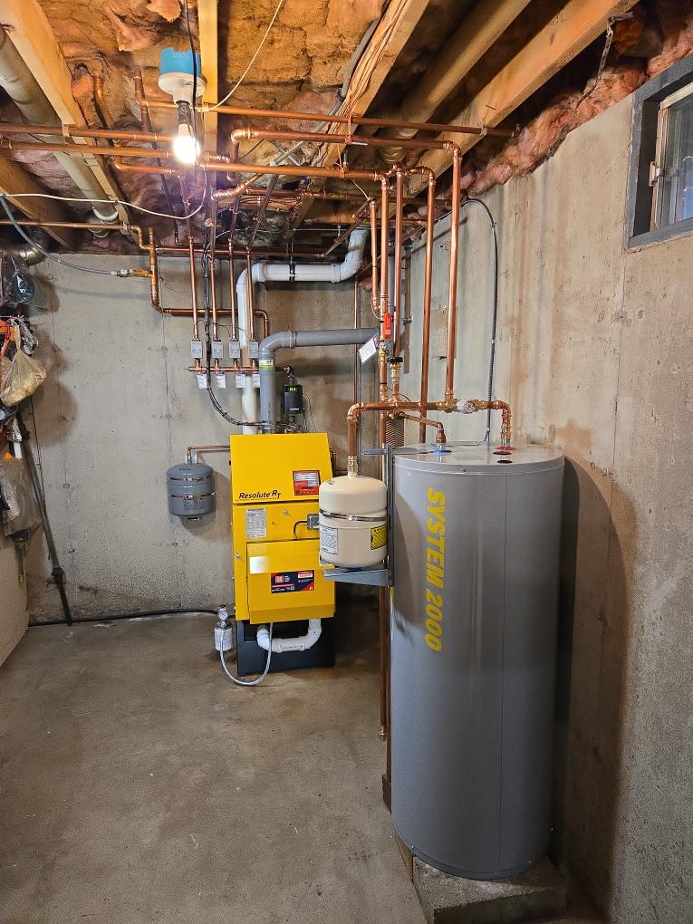 This proposal outlines the comprehensive replacement of your aging, power-vented oil heating system. We will upgrade your home to the highly efficient Energy Kinetics System 2000 Resolute RT.

Because your home does not utilize a chimney, your current setup relies on a bulky and often noisy external power venter. The advanced Resolute RT is specifically engineered to safely sidewall vent directly through the exterior, allowing us to completely eliminate that old power vent. We will also install a new 40-gallon indirect hot water tank to provide your home with abundant, highly efficient domestic hot water.

Scope of Work

1. Equipment Installation & Placement

Demolition: Safely drain, disconnect, and remove the existing 3-zone oil boiler and the external power venter.

The Boiler: Supply and install one (1) new Energy Kinetics Resolute RT high-efficiency oil boiler. To maximize your mechanical space, we will strategically rotate the new boiler during installation so it fits perfectly a