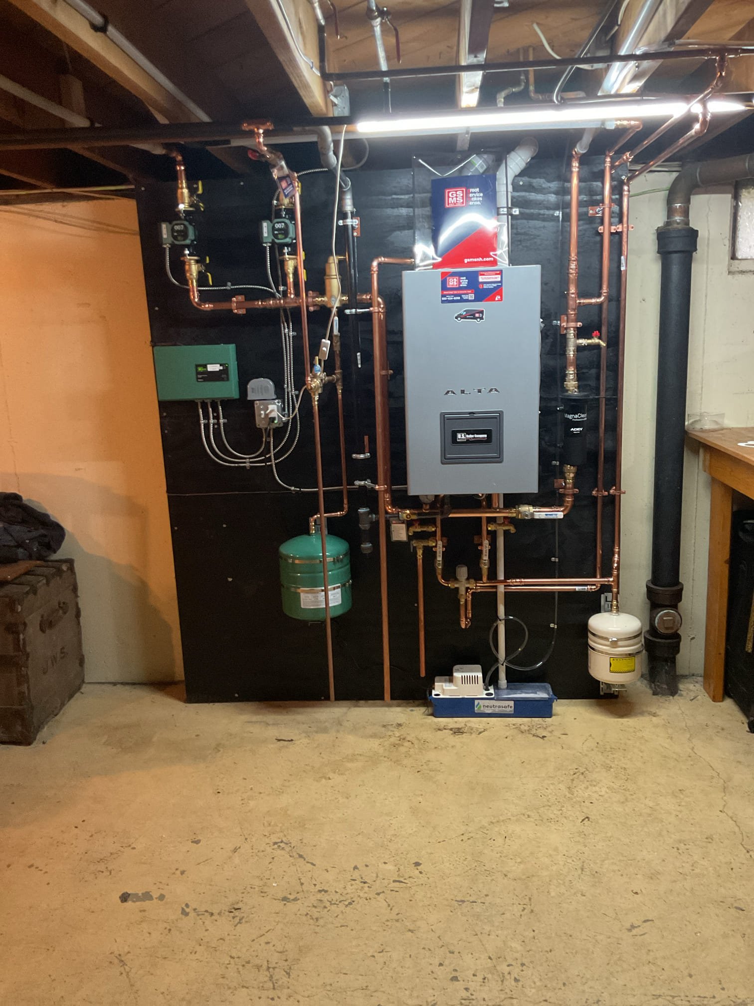 Scope of Work:
Upgrade to a High-Efficiency US Boiler Alta Series system, offering superior energy savings, quiet operation, and modern sealed-combustion technology.

Heating & Hot Water:

Boiler Installation: The new high-efficiency wall-hung unit will be installed in the basement, on the wall in the vacinity of the old boiler.

Domestic Hot Water: This boiler is a combi model so it will act as a tankless water heater, providing domestic hot water for the home. Expect an additional 30-second delay in heating.

Condensate Management: As a high-efficiency unit, this system produces condensate (water). We will install a condensate pump to route this moisture automatically to the available basement drain.

Venting (Sidewall):

Chimney Retirement: The existing chimney will be capped off and no longer used.

New Intake/Exhaust: We will install new PVC fresh air intake and Centrotherm exhaust piping. These lines will route through the unfinished basement ceiling and penetrate the exterior wa