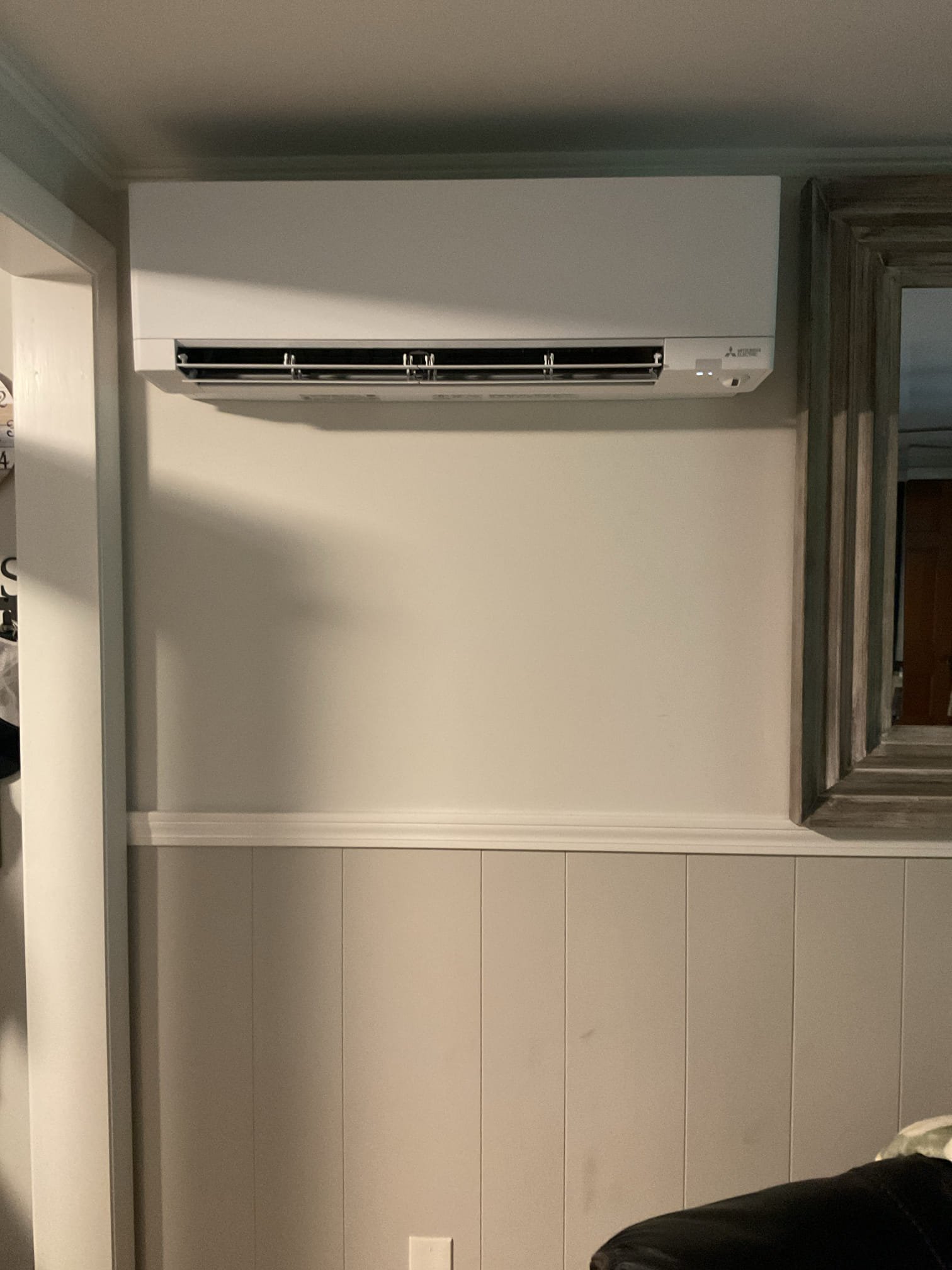 This proposal outlines the installation of a high-efficiency 2-zone Mitsubishi Hyper Heat ductless system. This system will completely eliminate your reliance on window AC units by providing powerful, whisper-quiet air conditioning throughout the summer. Furthermore, because it is a Hyper Heat model, it will provide you with highly reliable, efficient heating even during the coldest winter months, perfectly complementing your existing wood stove and helping to massively offset your electric heating usage.

Scope of Work

1. Indoor Equipment & Placement

Zone 1: Living Room

We will install a wall-mounted ductless head in the living room area, positioned to the right of the side door. (We have confirmed measurements to ensure a perfect fit in this location).

Zone 2: Primary Bedroom (Downstairs)

We will install a wall-mounted ductless head on the gable end of the home in the primary bedroom for dedicated comfort control.

2. Custom Line Set Routing & Aesthetics

Living Room Routing: Th