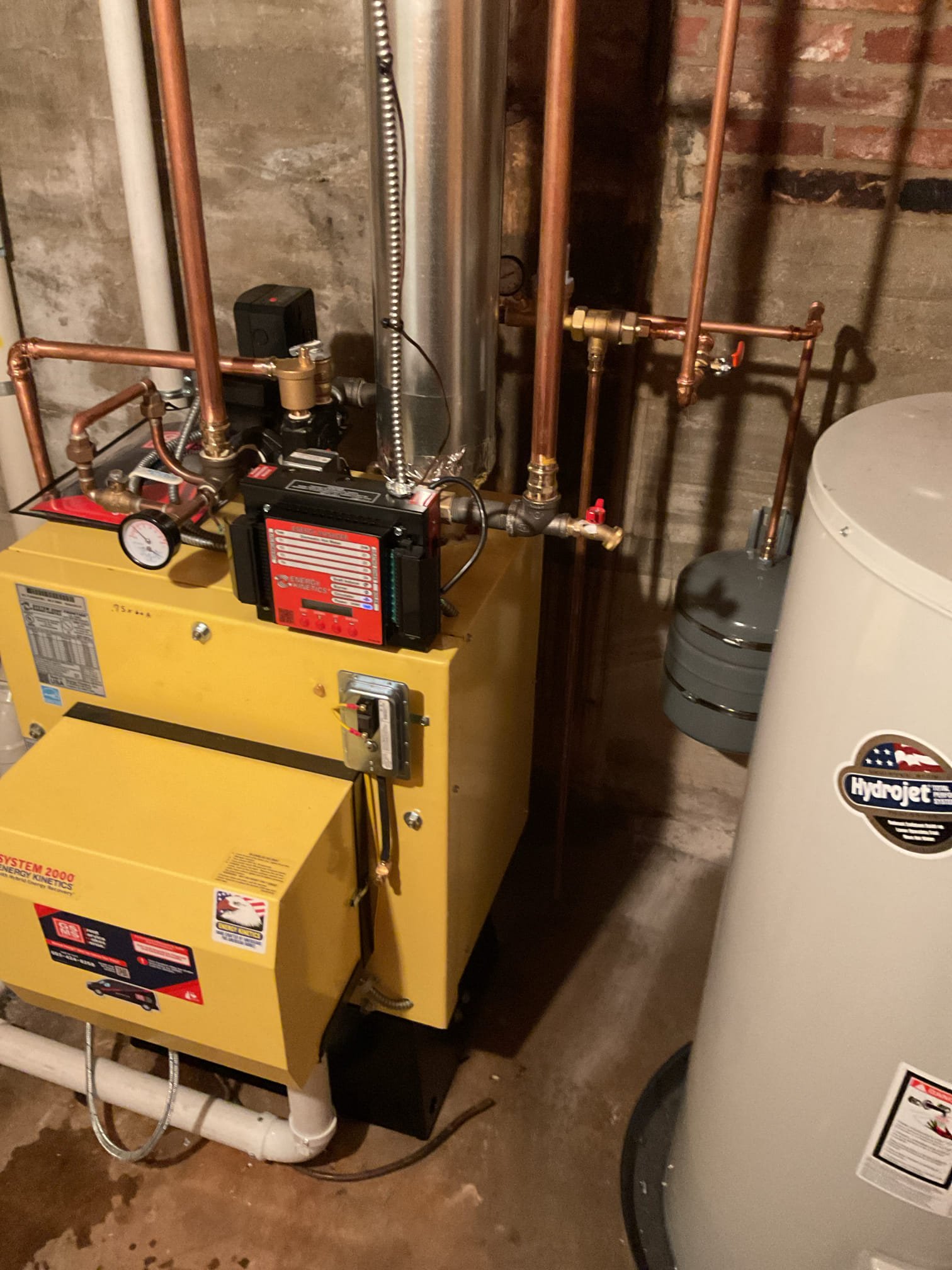 With your current oil boiler requiring more frequent service, this proposal outlines a premium, high-efficiency upgrade path to give you ultimate peace of mind and significantly lower your annual heating costs.

Instead of installing another heavy, standard cast iron boiler that wastes energy keeping itself hot in the mechanical room, we will upgrade your home to the Energy Kinetics System 2000. This advanced system utilizes a low-mass, spiral heat exchanger that rapidly transfers heat directly to your home. While this proposal configures the system for single-zone "heat only", it will still drastically cut down your annual fuel consumption while providing exceptionally quiet operation.

Scope of Work

1. Demolition & System Decommissioning

Extraction: We will safely drain the existing system, disconnect all ties, and remove the aging boiler.

Near-Boiler Re-piping: We will completely remove all the old near-boiler piping, aging valves, and old circulator pump. We will rebuild the ent