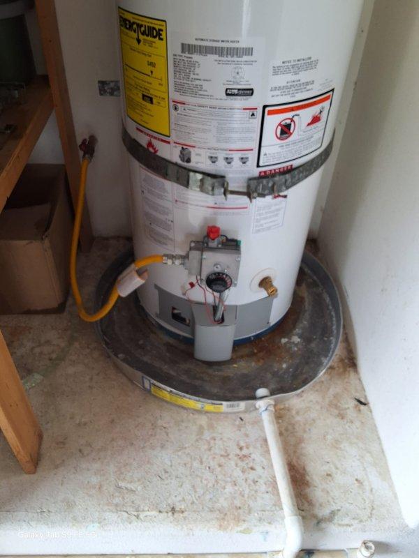 Replaced a 17-year-old leaking 40-gallon propane water heater with a new American Standard 40-gallon propane unit. The installation included connecting the flexible gas line, exhaust venting, water supply lines, and positioning the unit on a drip pan in the utility closet. Permit requirements were discussed with the property owner, and all work was completed to code specifications.