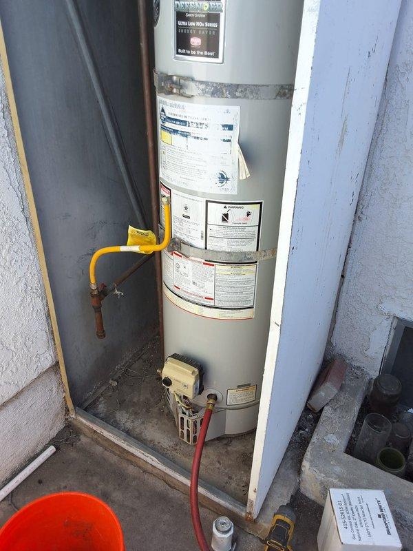 Responded to service call for pilot light repeatedly going out on Bradford White water heater model URG40T6N, serial number TE43448960. Upon arrival, unit was operational with pilot lit. Successfully relit pilot and tested gas control valve and thermocouple operation. Inspection revealed significant environmental concerns affecting unit longevity and safe operation. Water heater enclosure shows extensive moisture damage with deteriorating walls, peeling paint, and water staining throughout utility closet area, indicating inadequate ventilation and possible water intrusion issues. Venting system requires attention to ensure proper combustion air supply and exhaust. Current installation environment compromises equipment performance and contributes to recurring pilot outage issues. Unit is beyond original installation warranty period. Advised customer that while water heater is currently operational, the deteriorated enclosure and inadequate venting must be addressed to prevent continued 