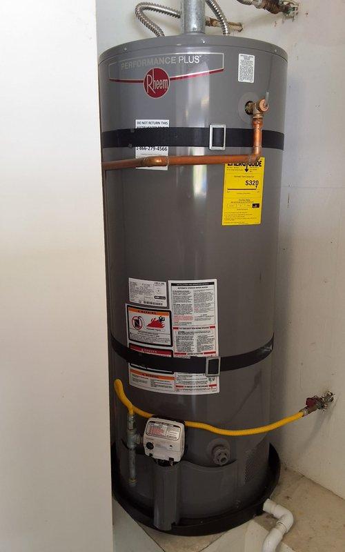 Completed installation of customer-supplied parts on Rheem Performance Plus water heater located in garage. All plumbing connections, gas line, and venting were properly secured and tested for proper operation upon completion.
