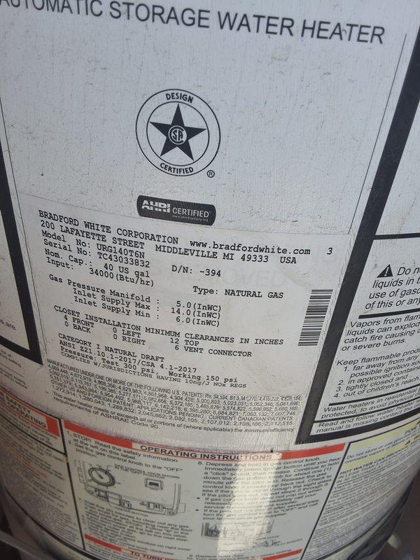 Responded to service call regarding a 7-year-old gas water heater that homeowner believed was previously installed by our company. Upon arrival, inspected Bradford White Corporation model URG140S6N, serial number HE41060, manufactured January 2017, which is a 40-gallon natural gas atmospheric storage water heater with 40,000 BTU/hr input rating. Performed visual inspection of unit and surrounding plumbing connections, including flexible gas supply lines, copper water piping, shutoff valves, and temperature/pressure relief valve discharge piping. Documented existing installation with photographs showing overall unit condition, manufacturer data plate specifications, and current piping configuration. Verified unit specifications and installation details, then provided homeowner with assessment and recommendations for next steps.