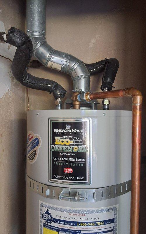 Responded to service call for leaking temperature and pressure relief valve on Bradford White water heater model URG140T6N. Upon arrival, found that homeowner had purchased and attempted to install replacement T&P valve but was unable to remove existing valve due to improper installation technique. Assessed the situation and successfully removed the improperly seated T&P valve using appropriate tools and procedures. Installed new temperature and pressure relief valve with proper thread sealant, torqued to manufacturer specifications, and verified proper seating and alignment. Tested T&P valve operation and confirmed no leaks at connection point. Unit returned to normal operation with all safety devices functioning correctly.