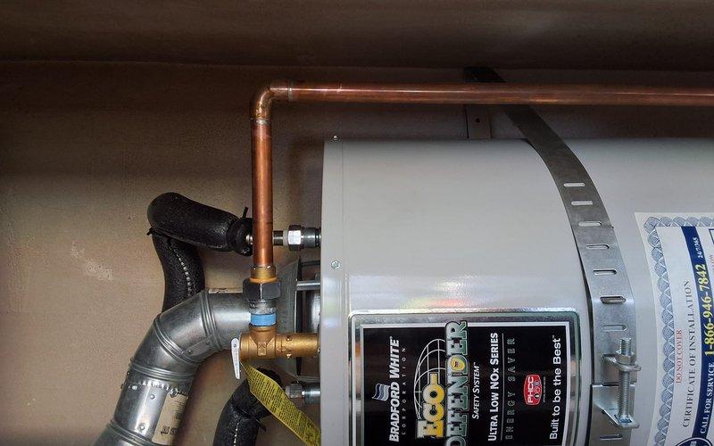 Responded to warranty callback for water heater unit model URG140T6N experiencing minor leak at temperature and pressure relief valve. Per customer request, installed dielectric union at T&P valve connection to prevent galvanic corrosion and improve seal integrity. Verified all connections, tested system operation, and confirmed leak has been substantially reduced with proper union installation.