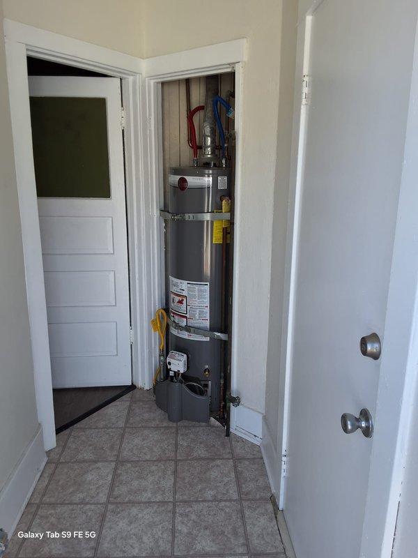 Responded to recurring no hot water complaint at property management unit. Replaced failed 40-gallon gas water heater with new Rheem unit in utility closet, including proper seismic strapping, copper supply line connections with color-coded flexible connectors, and gas valve assembly. Coordinated with property management per protocol before proceeding with tenant communication.