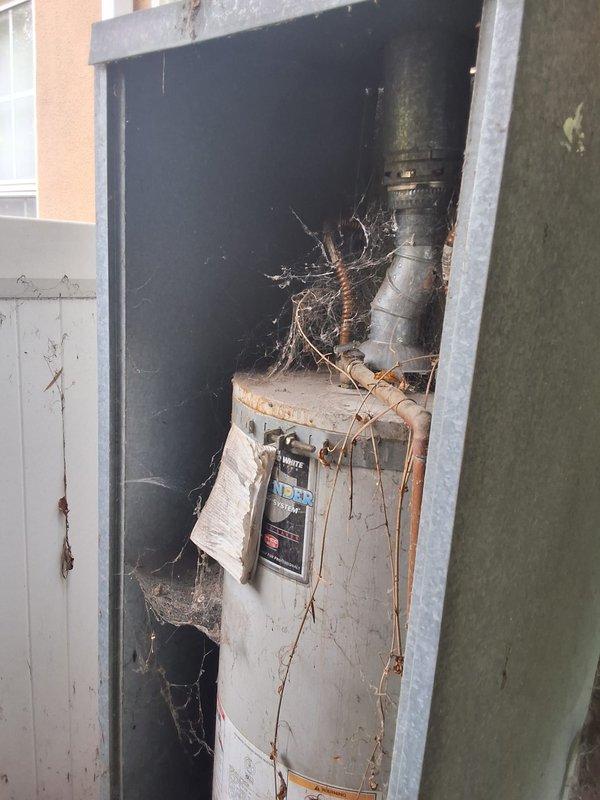 Replaced a 20-year-old 40-gallon gas water heater (Model M440T6FBN, Serial CB7342196) that was actively leaking. Removed the old unit from the utility closet, which showed significant deterioration with rust stains, corrosion on the vent pipe, and accumulated debris. Installed new 40-gallon gas water heater with proper venting and connections, ensuring all pressure settings were within specifications as verified by gauge readings.