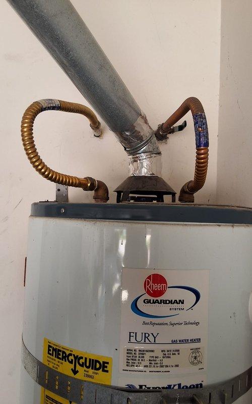Replaced failed 2006 50-gallon gas water heater that was actively leaking. Installed new Rheem Fury Guardian system 50-gallon gas water heater model GN50T1-3-6 with proper venting, copper supply line connections, and code-compliant safety features including TPR valve discharge piping. Secured permit and completed installation per local plumbing codes and manufacturer specifications.