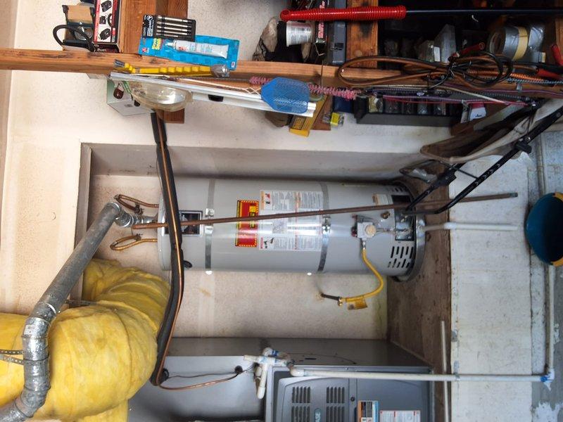 Responded to a leaking 50-gallon gas water heater located in the garage. Completed full replacement of the failed unit with a new 50-gallon gas water heater, including proper connection of all water supply lines, gas line, and venting systems. Installed new copper piping connections, secured flexible gas line to manufacturer specifications, and ensured all safety labels and temperature-pressure relief valve were properly positioned. Tested unit for proper ignition, verified no gas leaks at connections, confirmed adequate hot water delivery, and inspected all plumbing connections for leaks before final approval.