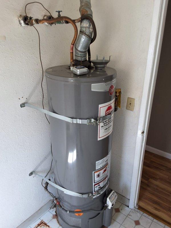 Completed inspection and estimate for all-electric conversion of existing 50-gallon gas water heater to heat pump water heater system. Assessed current installation including gas line connections, venting configuration, electrical requirements, and spatial constraints in utility closet. Discussed permit requirements for conversion work and provided detailed estimate covering removal of existing gas unit, disconnection and capping of gas line, installation of new heat pump water heater with appropriate electrical service upgrades, condensate drainage modifications, and seismic strapping per code. Documented existing plumbing connections, drain pan configuration, and available clearances for heat pump unit installation.
