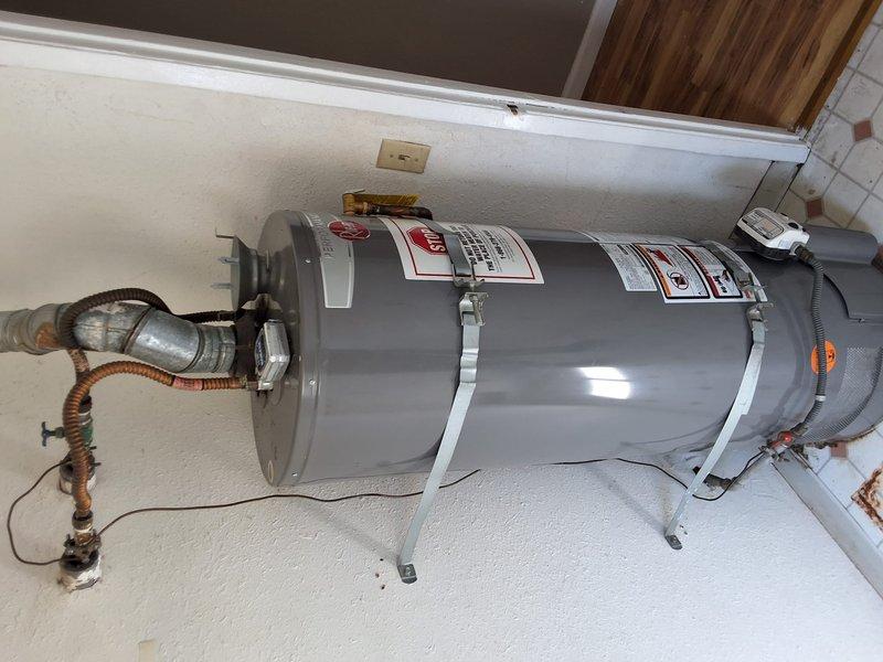 Completed inspection and estimate for all-electric conversion of existing 50-gallon gas water heater to heat pump water heater system. Assessed current installation including gas line connections, venting configuration, electrical requirements, and spatial constraints in utility closet. Discussed permit requirements for conversion work and provided detailed estimate covering removal of existing gas unit, disconnection and capping of gas line, installation of new heat pump water heater with appropriate electrical service upgrades, condensate drainage modifications, and seismic strapping per code. Documented existing plumbing connections, drain pan configuration, and available clearances for heat pump unit installation.