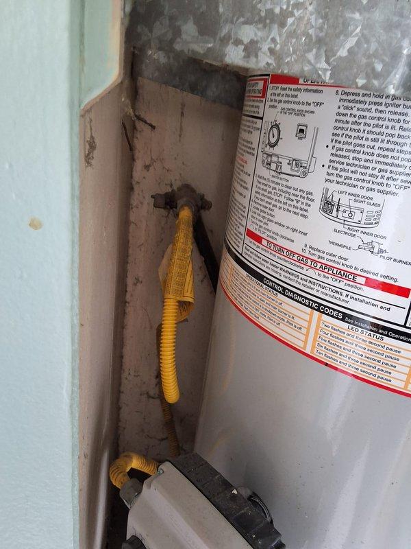 Performed inspection and estimate for conversion from existing 30-gallon gas water heater to tankless gas system. Evaluated current installation including kitchen gas water heater and solar storage tank in garage to assess solar system functionality and compatibility with proposed tankless conversion. Documented existing plumbing infrastructure, gas lines, venting requirements, and electrical connections. Photographed current water heater installation, surrounding framing, gas and water supply lines, and overhead utility routing to develop comprehensive conversion proposal including necessary permits and installation requirements.