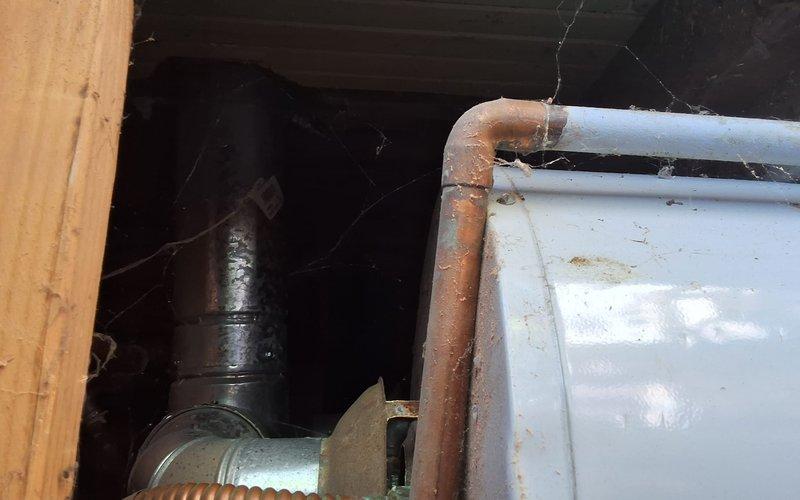 Performed estimate-only inspection on aging 50-gallon gas water heater in basement. Unit exhibited odor issues and showed signs of deterioration consistent with age. Evaluated existing installation conditions, including plumbing connections, venting system, and surrounding utility space. Documented current equipment condition through photographs showing water heater installation, copper supply lines, and associated mechanical infrastructure. Discussed replacement options with customer, presenting GN50T1-3-6 model as suitable replacement unit. Reviewed permit requirements for water heater replacement and confirmed understanding of necessary permitting process. Provided ballpark estimate range for complete replacement installation including new unit, labor, and materials, with permit fees to be determined separately. Explained available payment methods and scheduled follow-up appointment for Friday afternoon service window.