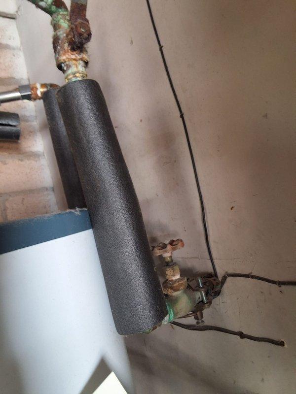 Responded to service call for leaking residential gas water heater. Upon inspection, found approximately 20-year-old 40-gallon gas unit with active leak and severe corrosion on inlet/outlet connections and fittings. Removed and disposed of failed water heater. Installed new 40-gallon residential gas water heater on existing wooden platform, connected all supply and discharge lines, installed new pressure relief valve with discharge piping, and tested all connections for proper operation and leak-free performance. Advised customer of permit requirements and provided pricing estimate range for complete replacement. Unit operational and system functioning properly upon departure.