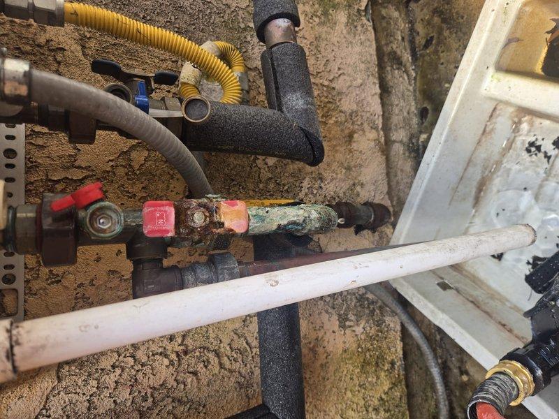 Responded to no hot water complaint on tankless water heater model NCC300OD. Upon inspection, discovered severely corroded piping connections at the unit with heavy rust buildup, green oxidation, and mineral deposits on copper pipe sections. Diagnosed failed heat exchanger as root cause of no hot water condition. Replaced heat exchanger under warranty coverage. Documented existing pipe corrosion for future maintenance consideration. Unit tested and restored to full operation with proper hot water delivery confirmed.