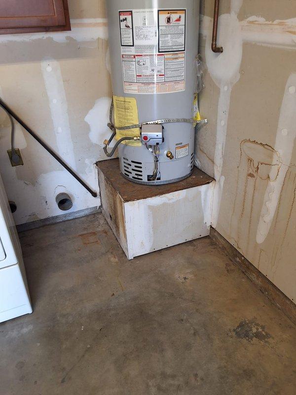 Completed preventative replacement of residential gas water heater with 40-gallon unit, model M440T6FBN. Installed water heater on wooden platform in utility room with proper seismic strapping to wall, connected copper supply lines and gas line, installed temperature/pressure relief valve with discharge piping, and vented unit through ceiling per manufacturer specifications. Customer advised that permitting is their responsibility to complete.