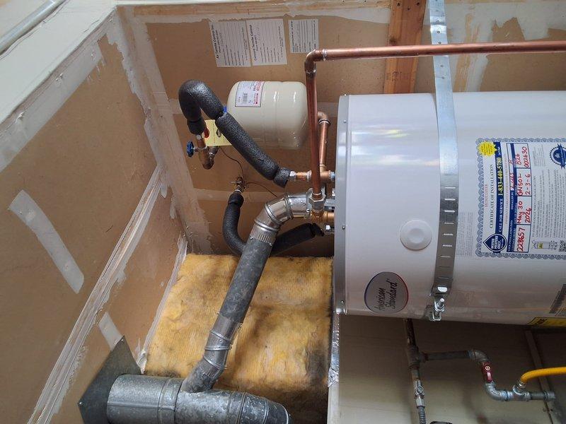Responded to warranty callback for gas odor complaint on water heater model GN50L-2-3-6. Tightened T-coupling connection on gas line to eliminate leak. Verified all gas connections secure and system operating safely per manufacturer specifications.