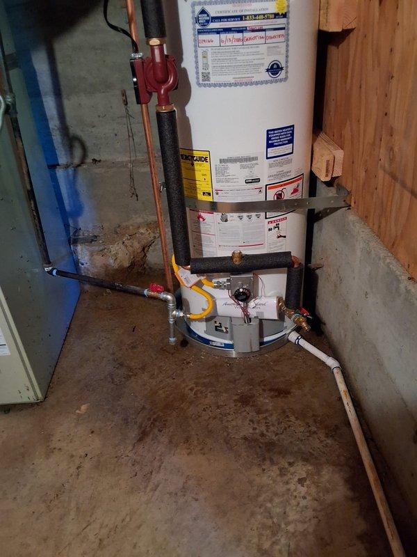 Successfully completed residential water heater replacement, downsizing from 100-gallon unit to new 50-gallon Guardian water heater with recirculation pump system. Installation included drain pan, upgraded 12-year anode rod, extended 2-year labor warranty, and all necessary copper piping connections with shut-off valves. Flexible yellow gas line properly connected to new unit, pressure relief valve and drainage components installed to code, and permit obtained for the work performed in basement utility area.