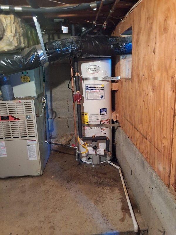 Successfully completed residential water heater replacement, downsizing from 100-gallon unit to new 50-gallon Guardian water heater with recirculation pump system. Installation included drain pan, upgraded 12-year anode rod, extended 2-year labor warranty, and all necessary copper piping connections with shut-off valves. Flexible yellow gas line properly connected to new unit, pressure relief valve and drainage components installed to code, and permit obtained for the work performed in basement utility area.