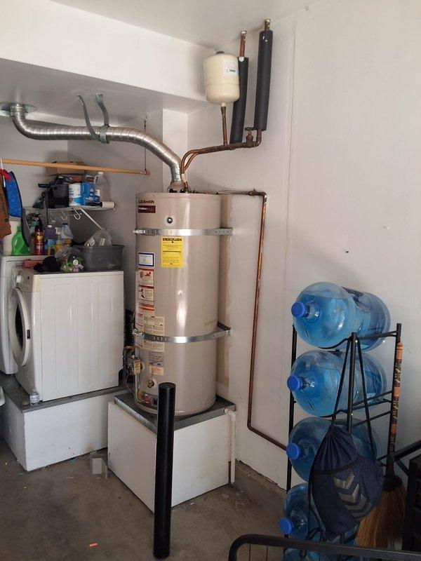 Replaced a 2007 AO Smith GVR50100 water heater with a new 50-gallon gas atmospheric vent unit due to no hot water condition. Installation included proper earthquake strapping, flexible copper connectors for thermal expansion, corrugated stainless steel water lines, and aluminum exhaust venting per code requirements. Customer was advised of permitting requirements and arrival window was scheduled for Saturday between 1-4 PM.