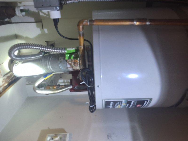 Conducted inspection and consultation for conversion from existing 50-gallon standard gas water heater located in interior closet to tankless water heating system. Evaluated current installation configuration, existing gas supply lines, venting requirements, and available space for tankless unit placement. Presented Navien tankless water heater as recommended replacement option, discussed installation requirements including necessary modifications to gas piping, venting system, electrical connections, and water supply lines. Reviewed operational benefits of tankless technology including continuous hot water supply and improved energy efficiency compared to traditional tank-style units.