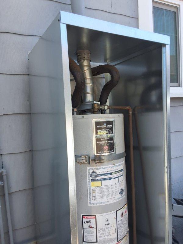 Completed replacement of 8-year-old Bradford White 40-gallon gas water heater (Model URG140T6N, Serial SF41573648) installed in exterior enclosure. Removed existing unit and installed new gas water heater with proper venting and connections. Verified all gas lines, water supply connections, and exhaust flue pipe installations meet code requirements. Unit tested and operational upon completion.