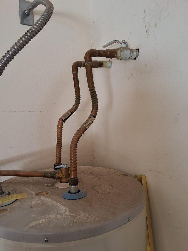 Replaced existing residential water heater in garage with new RE350S6 50-gallon electric unit mounted on elevated platform to meet current code requirements for vacant home sale. Installed new flexible water supply connections, verified proper electrical hookup, and ensured all plumbing connections were secure and leak-free. Unit tested and operational upon completion with all safety features functioning properly.
