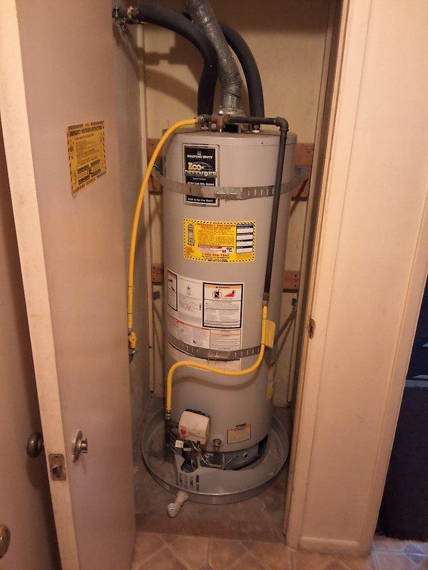 Replaced leaking 50-gallon residential gas water heater with new unit installed in interior closet space. Installation included connecting flexible gas line, water supply piping, venting ducts, and pressure relief valve with exterior discharge. Permit requirements were discussed with property owner prior to completing the work.