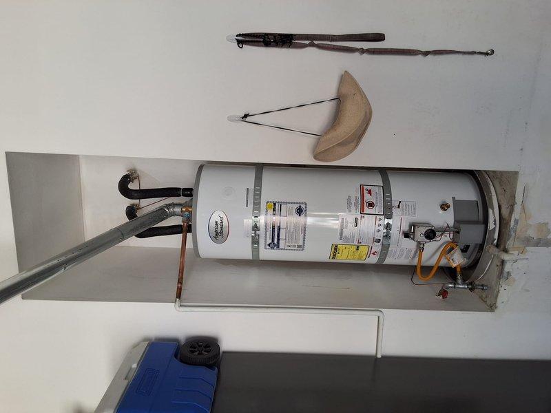 Responded to service call for leaking 14-year-old 50-gallon gas water heater. Removed and properly disposed of failed unit, then installed new 50-gallon gas water heater with all necessary connections including gas line, water supply lines, and pressure relief valve. Tested system operation, verified proper water pressure at approximately 50 psi, confirmed no leaks at all connections, and ensured compliance with permitting requirements.