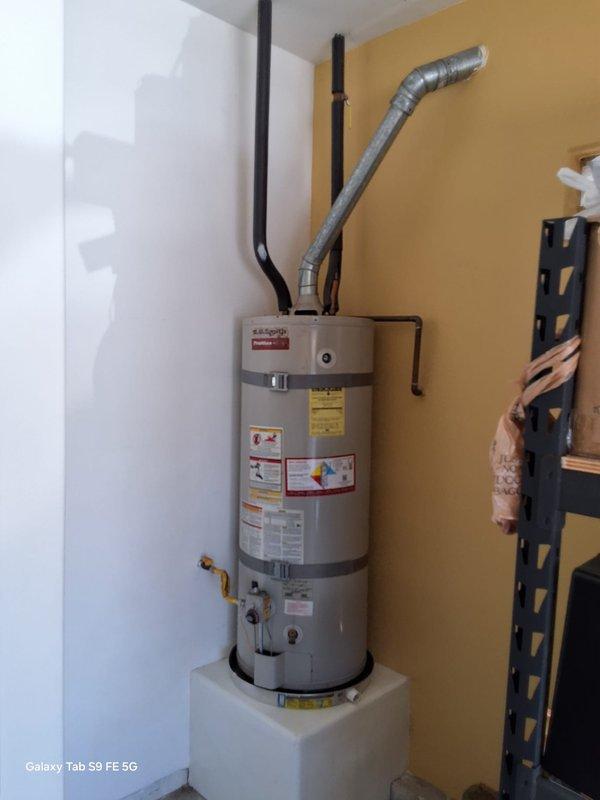 Performed inspection on leaking 40-gallon A.O. Smith gas water heater. Assessed condition of unit, gas valve assembly with flexible gas line connection, plumbing connections, and venting system. Documented existing installation including drip pan placement and confirmed leak condition requiring replacement. Provided estimate for new A.O. Smith model GN40T1-3-612YR 40-gallon gas water heater installation with 12-year warranty. Discussed permit requirements and scheduled installation appointment.