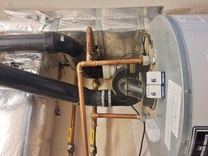 Responded to no hot water complaint at property management account. Upon arrival, evaluated 2010 Bradford White 75-gallon gas water heater (model PV, serial GG13690631) with circulation pump system. Tank exhibited age-related deterioration with oxidized copper piping connections and normal wear patterns consistent with 13+ years of operation. Due to unit age and lack of hot water production, recommended complete water heater replacement rather than repair. Documented existing installation configuration including top-mounted circulation pump with electrical connections, copper supply and distribution piping with yellow-handled isolation valves, venting system, and proper clearances. Photographed equipment nameplate data, piping connections, pump assembly, and overall installation for replacement estimate preparation. Contacted office with findings per property management protocol for pricing and approval process.