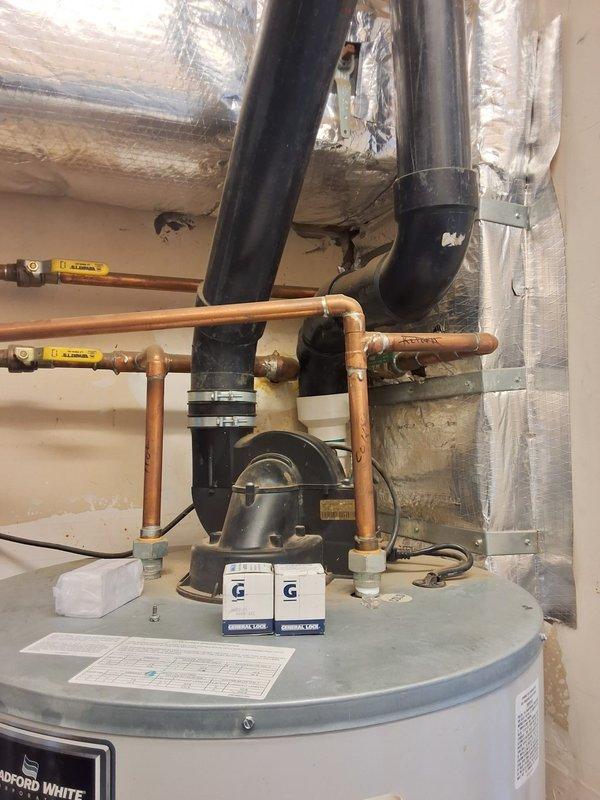 Responded to no hot water complaint at property management account. Upon arrival, evaluated 2010 Bradford White 75-gallon gas water heater (model PV, serial GG13690631) with circulation pump system. Tank exhibited age-related deterioration with oxidized copper piping connections and normal wear patterns consistent with 13+ years of operation. Due to unit age and lack of hot water production, recommended complete water heater replacement rather than repair. Documented existing installation configuration including top-mounted circulation pump with electrical connections, copper supply and distribution piping with yellow-handled isolation valves, venting system, and proper clearances. Photographed equipment nameplate data, piping connections, pump assembly, and overall installation for replacement estimate preparation. Contacted office with findings per property management protocol for pricing and approval process.